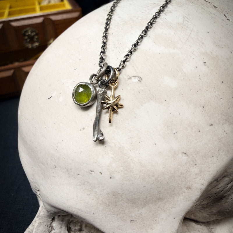 sterling silver charm bundle with green gemstone, 14k gold star and a tiny cat bone 